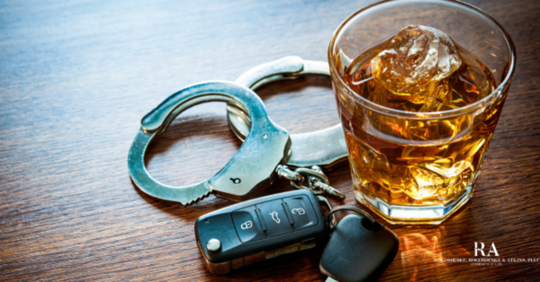 handcuffs, keys, and alcohol